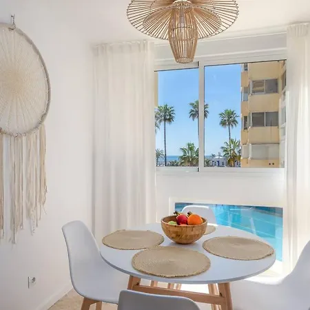 En Front De *
